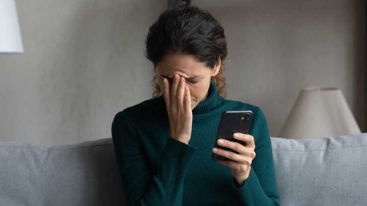 Woman with mobile stressed