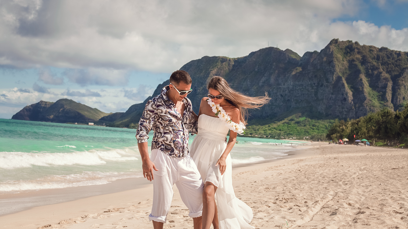 Beautiful Couple on beach vacation travel holiday in Hawaii. Oahu island, Hawaii USA destination.