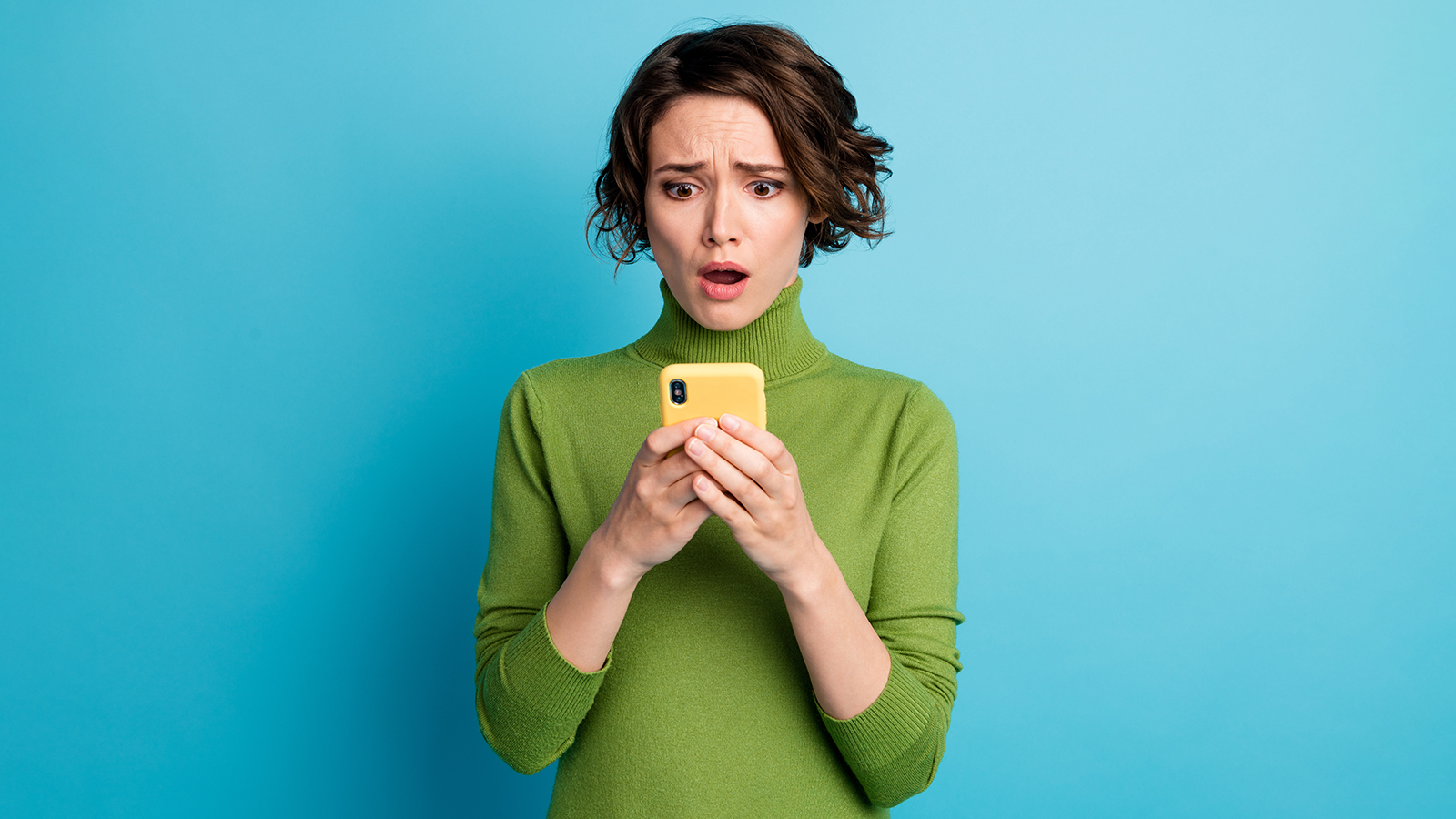 Portrait of frustrated addicted social media woman use cell phone impressed small followers subscribers wear style stylish trendy jumper isolated over blue color background