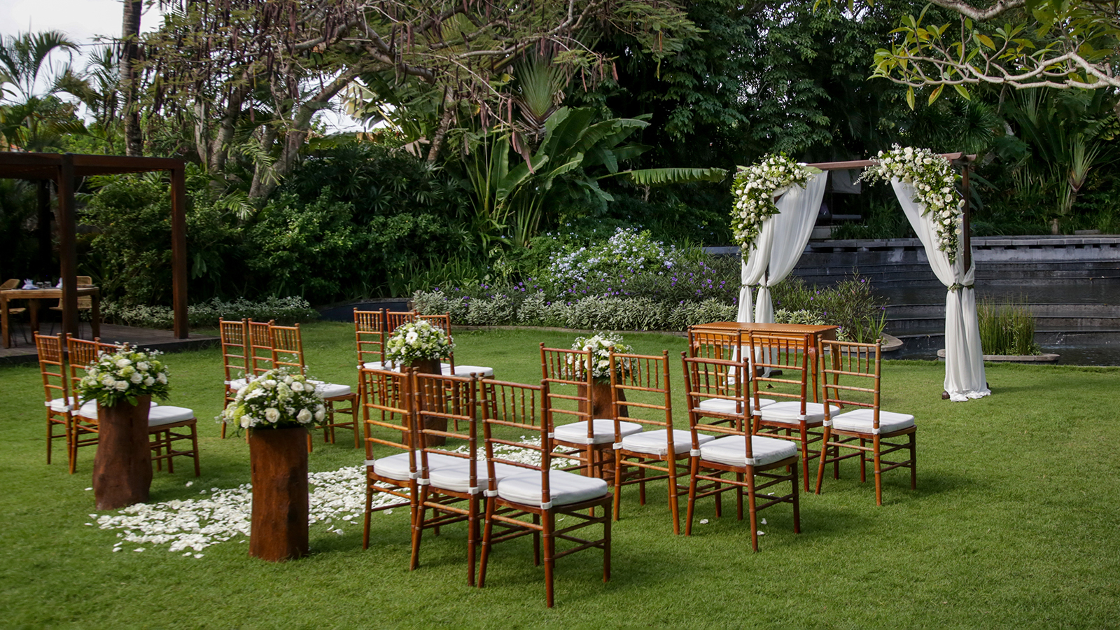 Beautiful romantic outdoor wedding setup in tropical garden, woo