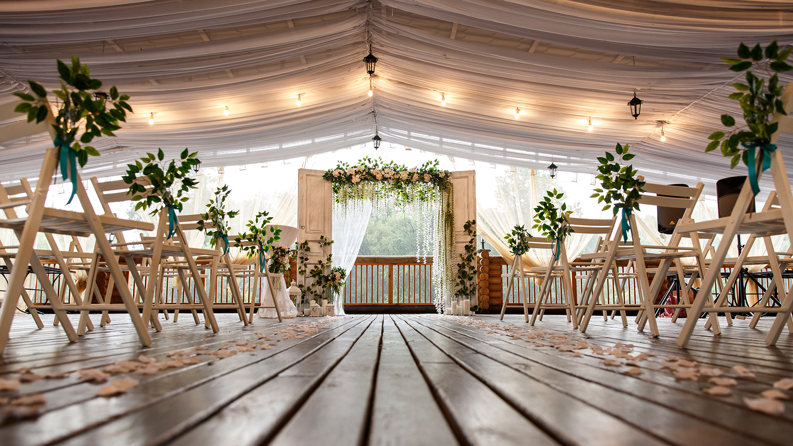 Wedding arch for wedding ceremony. Beautiful wedding decor in rustic style and chairs for guests