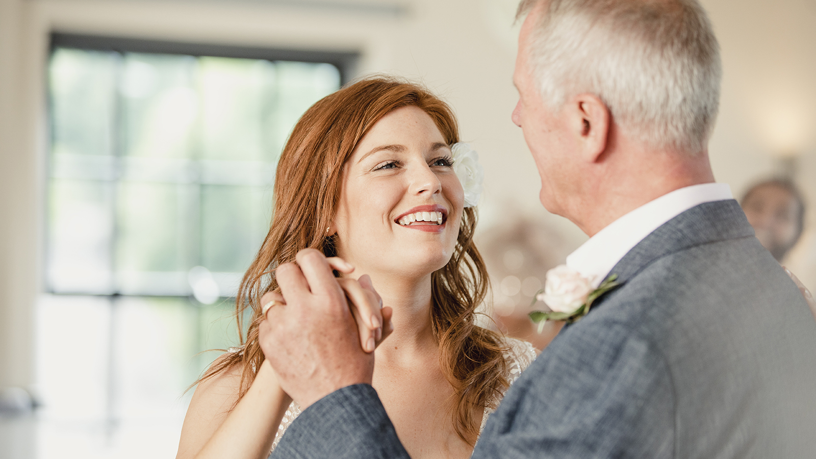 Beautiful bride is enjoying a dance with her father on her wedding day.