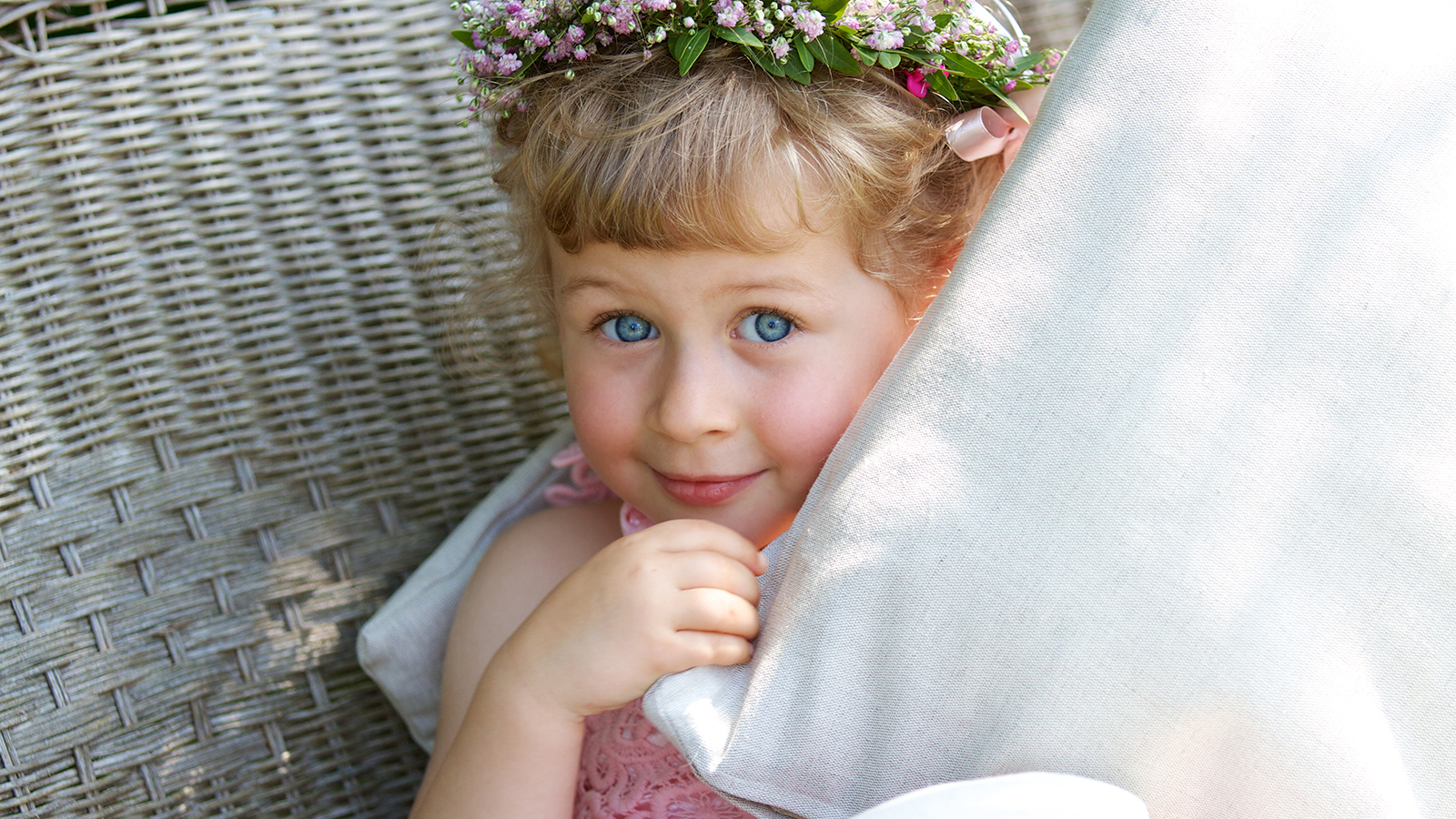 Three years old bridesmaid with wreath on the head