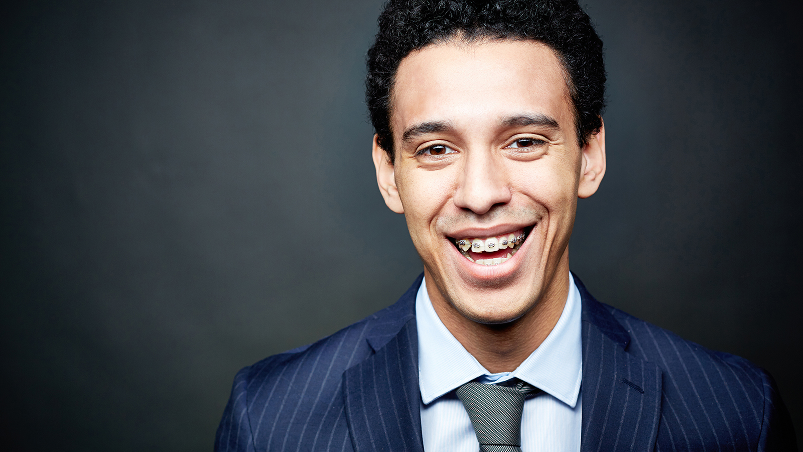 Portrait of a businessman wearing braces and smiling confidently