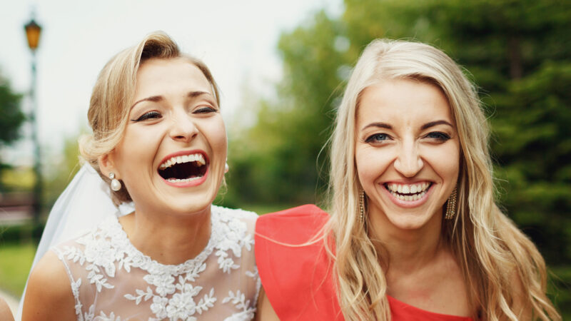 Sincere laugh of the bridesmaids and a bride
