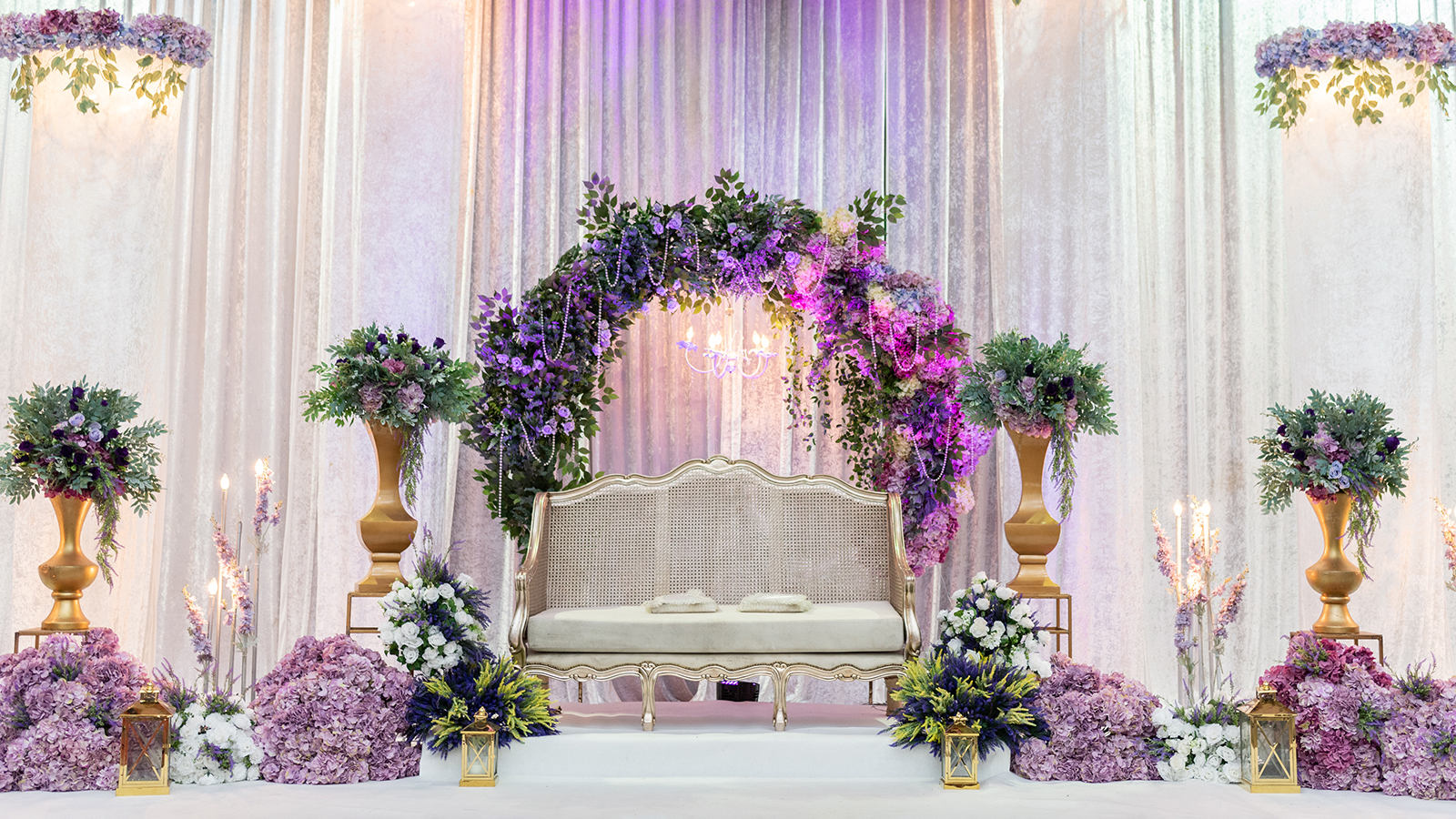Luxury Wedding Arch with floral decorations in the form of big vases and bouquets, tall white backdrop and tall flowers post