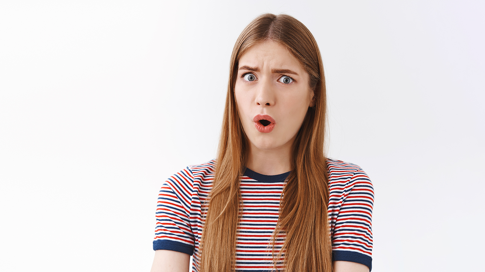 Close-up shocked and freak-out, concerned young serious-looking woman stare skeptical and confused, say what, open mouth gasping alarmed, frowning doubtful and disappointed, white background