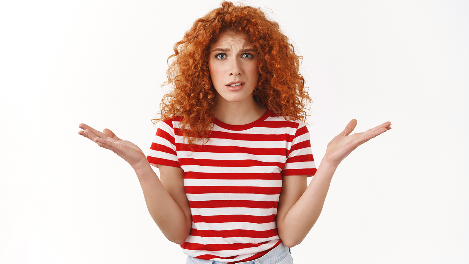 What wrong you. Redhead curly-haired young freak out complaining woman arguing shrugging dismay raise hands sideways puzzled questioned cringing bothered standing white background