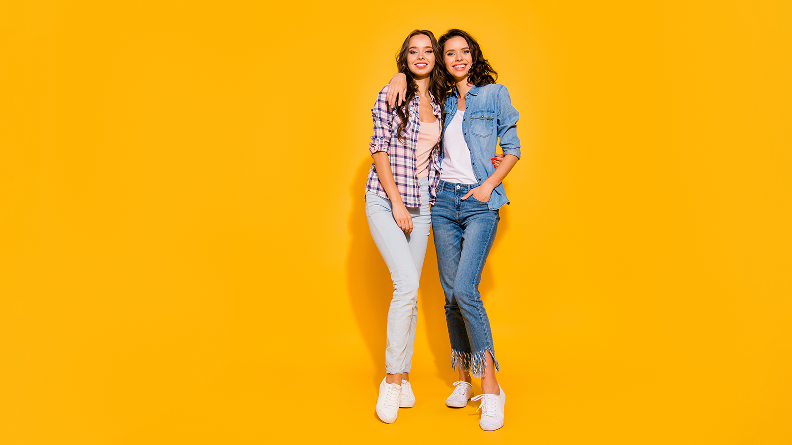 Full length body size view photo nice charming ladies youth cudling free time weekends summer glad content candid dressed checkered denim suit legs fashionable sneakers isolated colorful background.