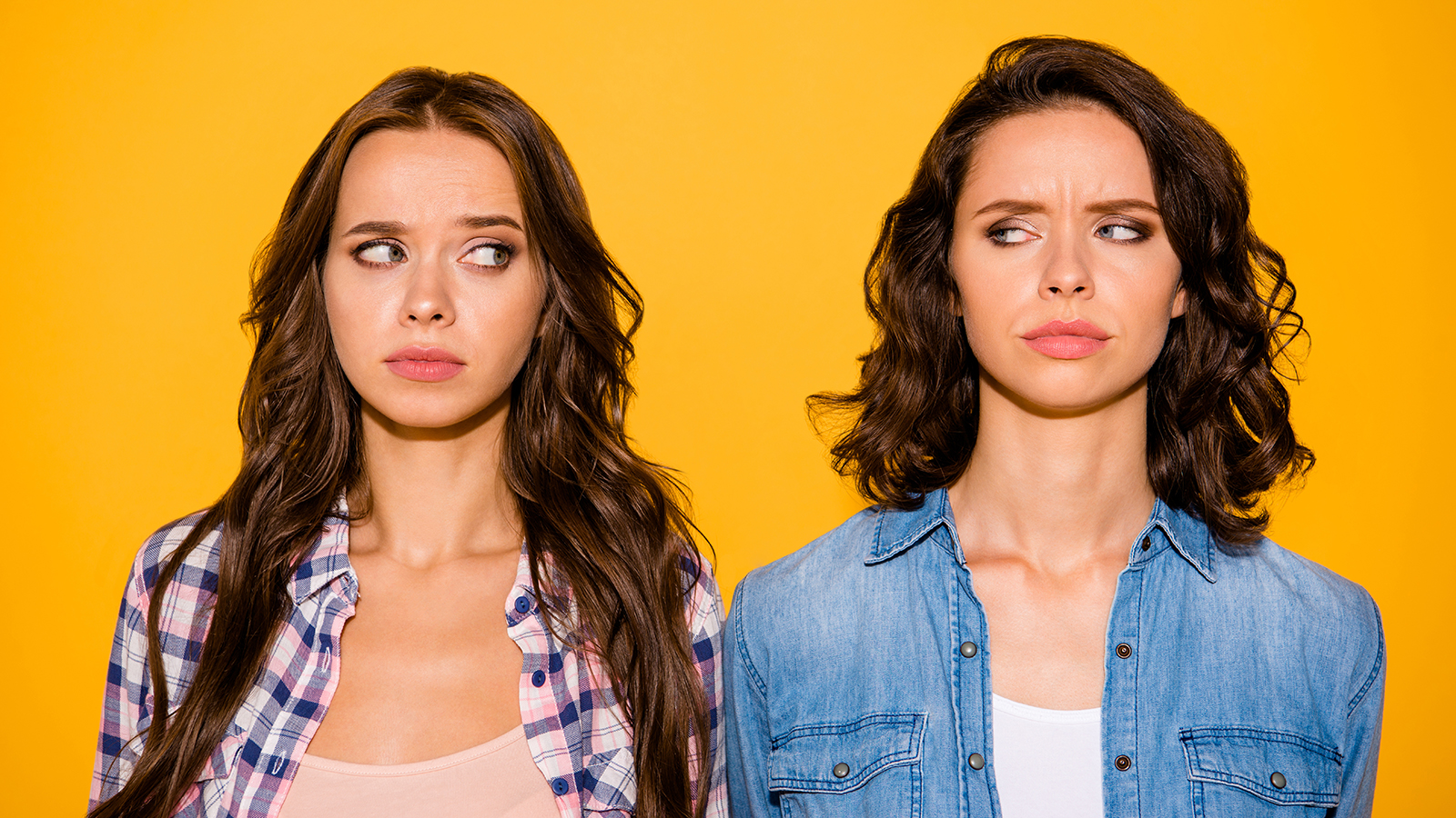 Close up photo of frustrated irritated beautiful ladies fellows fellowship have disagreement misunderstanding ignore depression dressed checked denim clothing modern on yellow background isolated