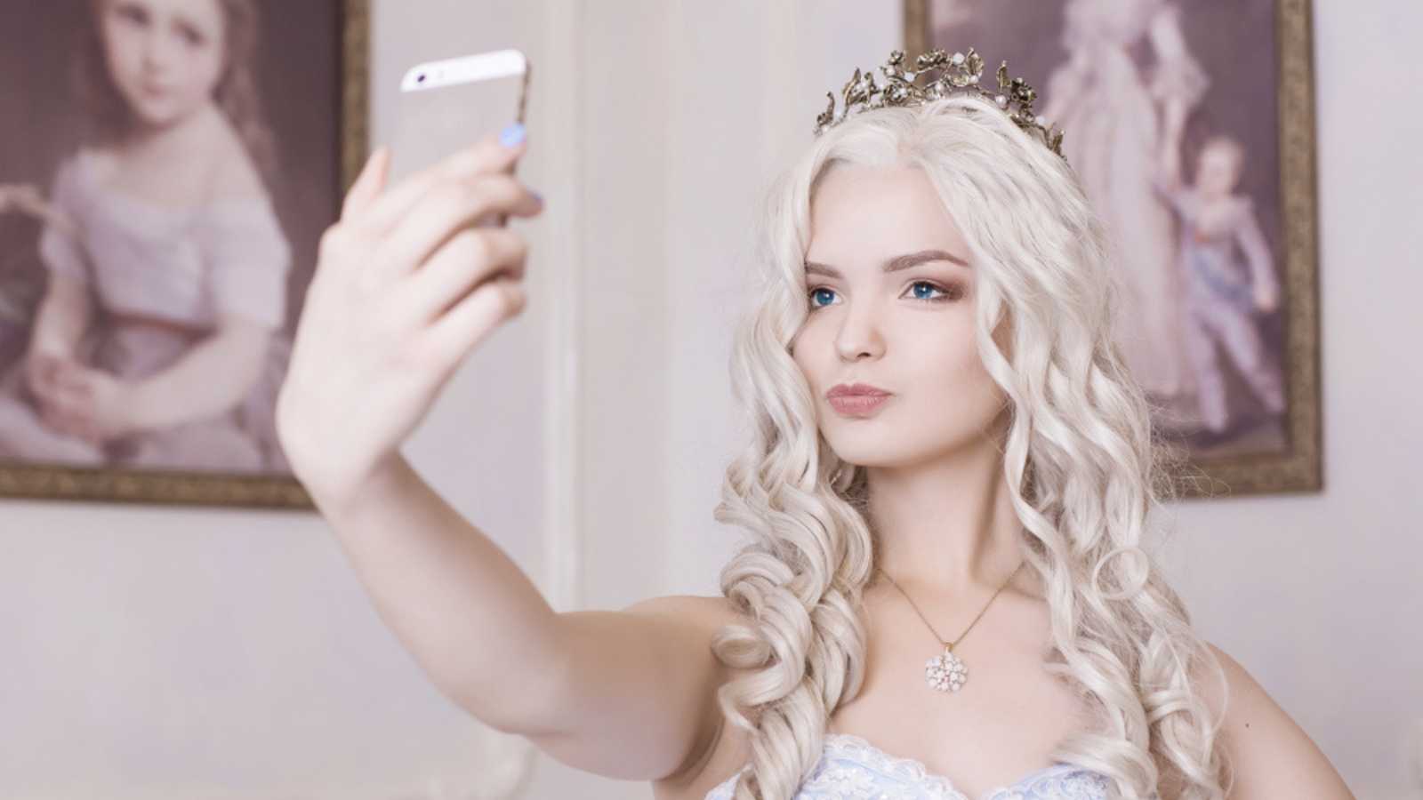 Bridesmaid with mobile taking selfie