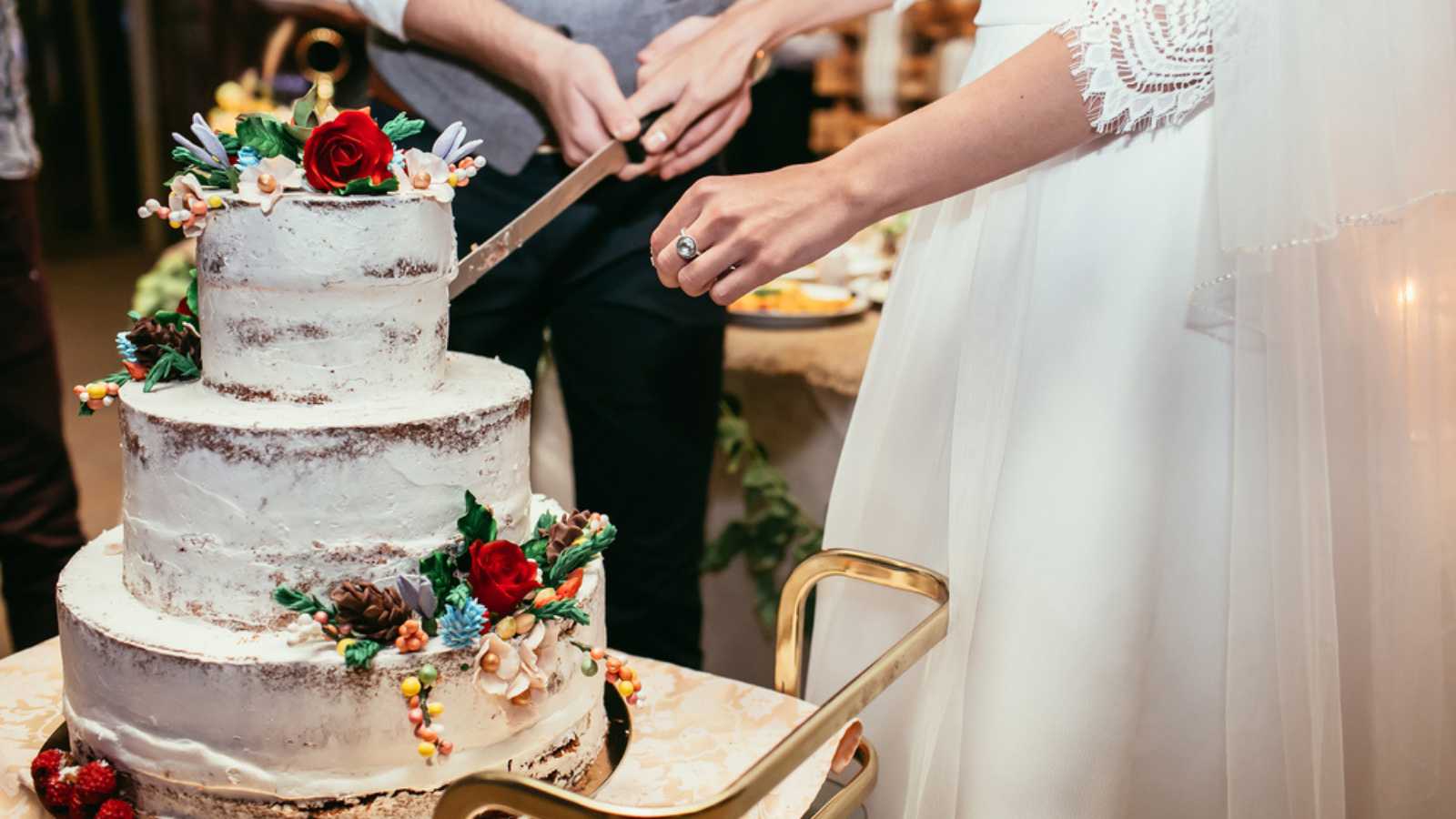 bride and groom cut rustic wedding cake 