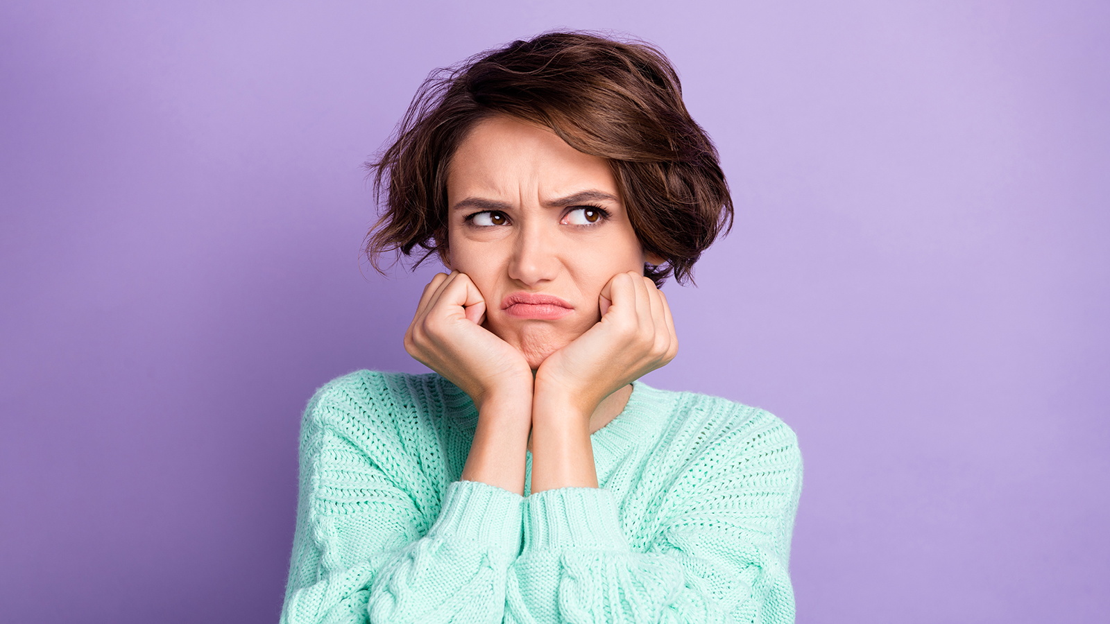 Photo of young unhappy upset sad irritated offended girl look copyspace have conflict isolated on purple color background