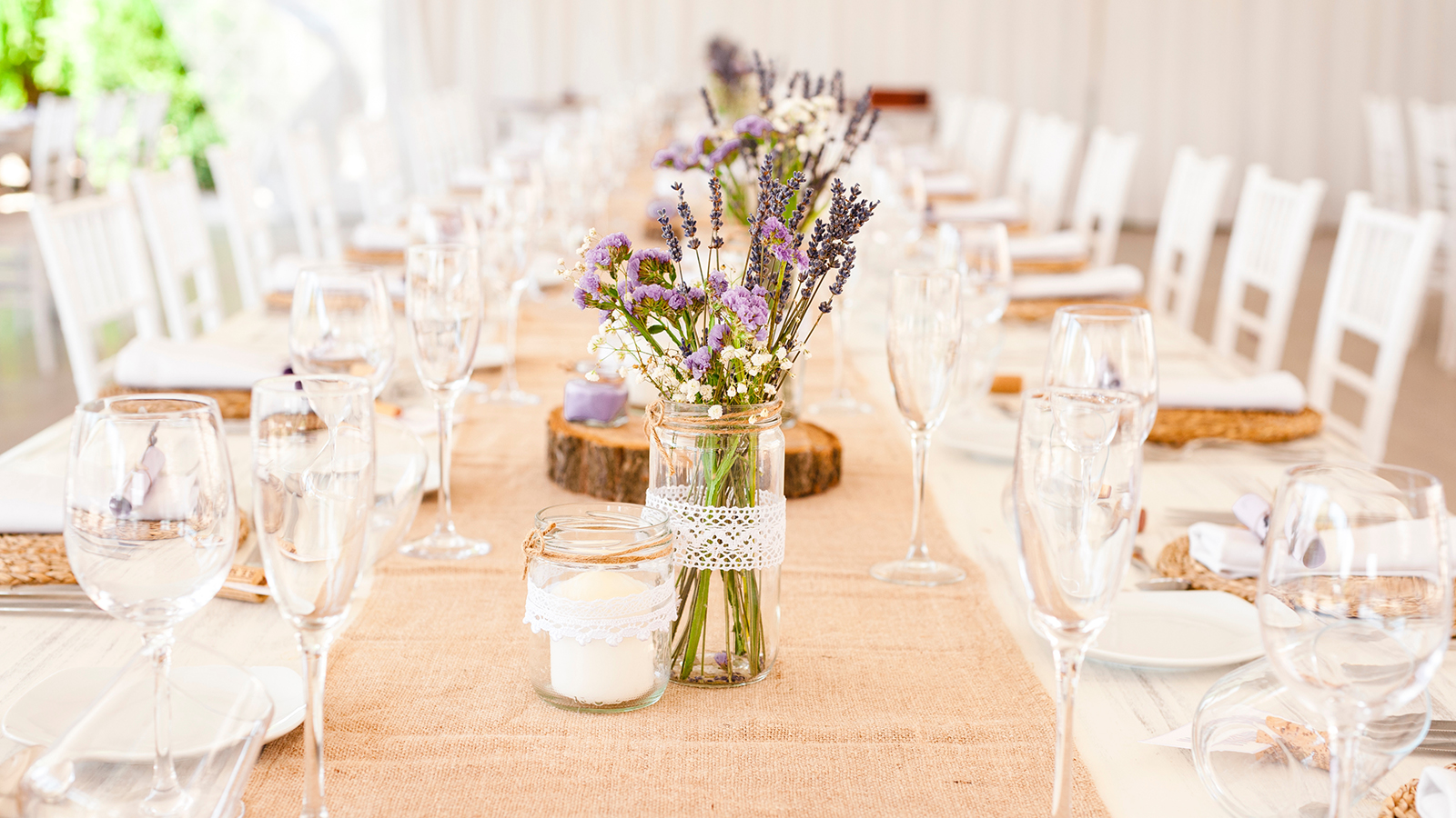 Decorated table with aromatic lavender plants ready for a weddin