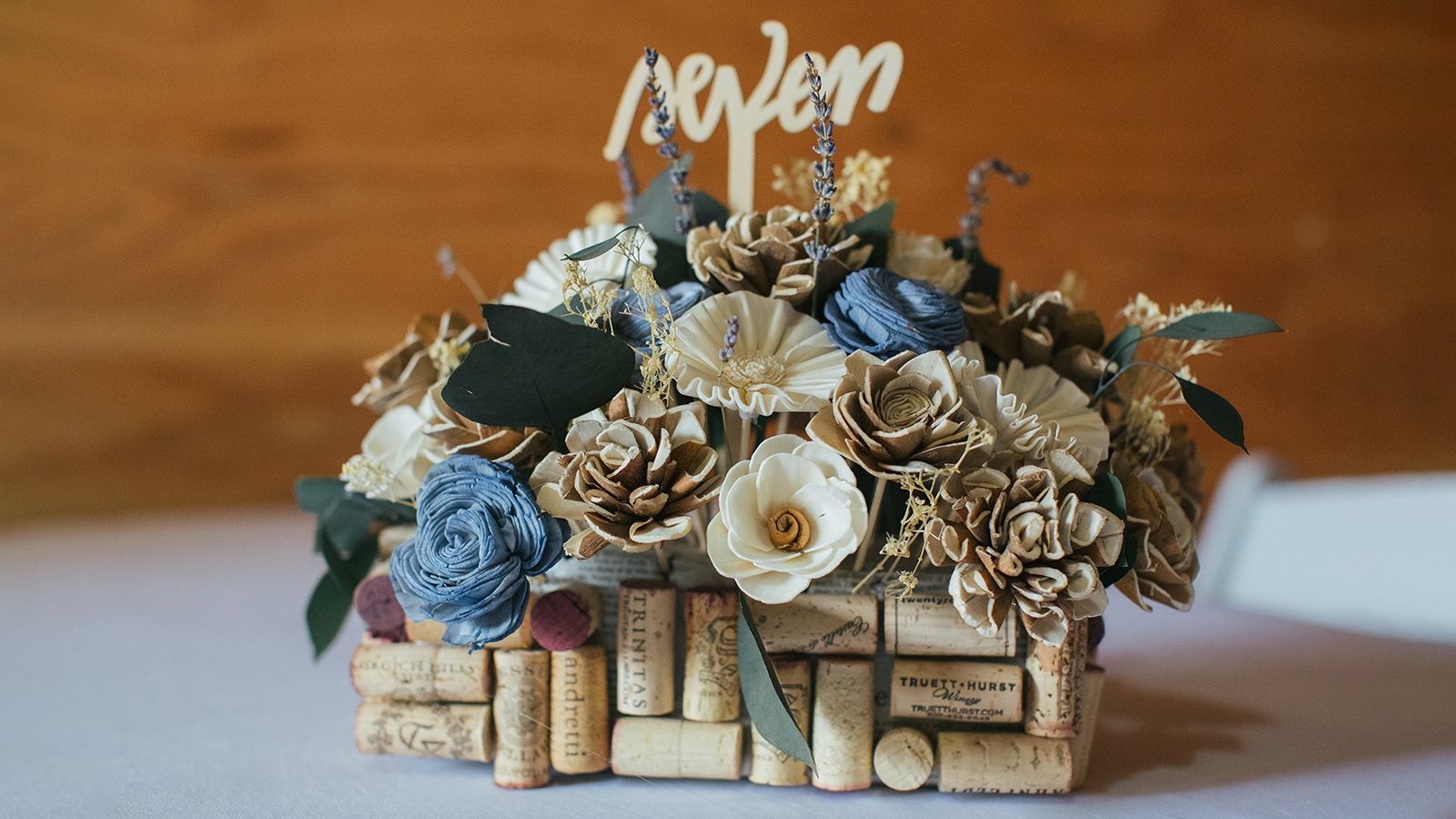 Vacaville, CA - November 10, 2018: A handmade wedding reception table centerpiece with flowers made from wood and paper.