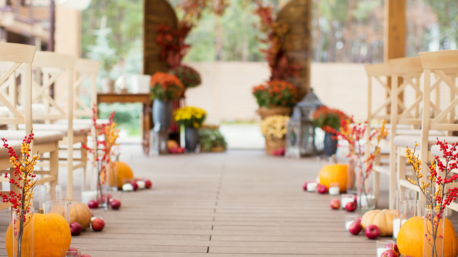 autumn wedding ceremony with flowers and pumpkins