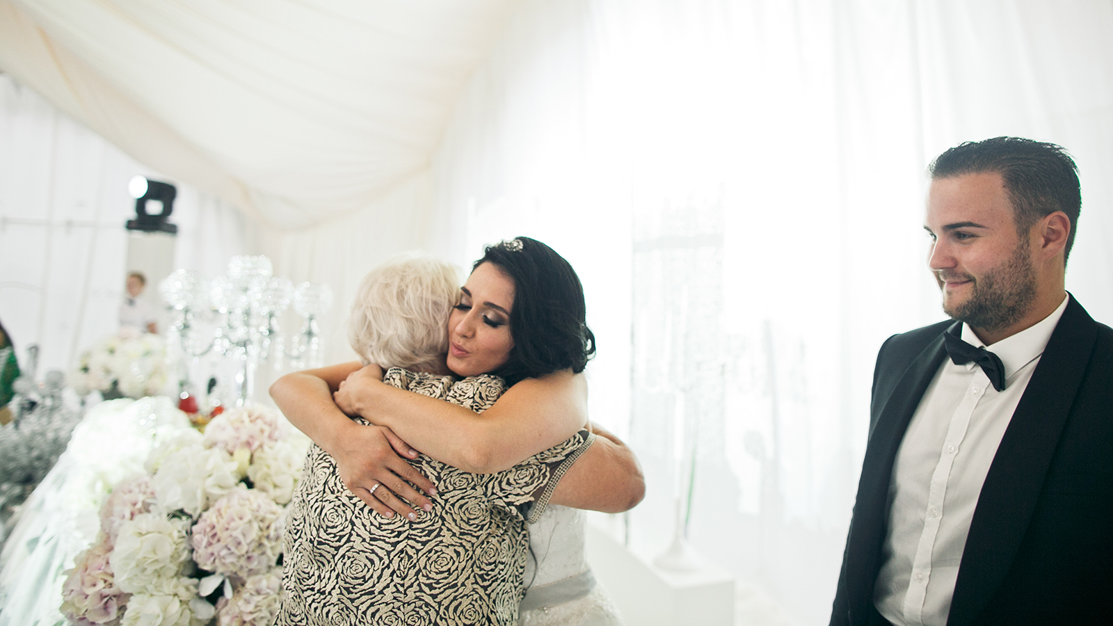 The charming bride embracing her mother