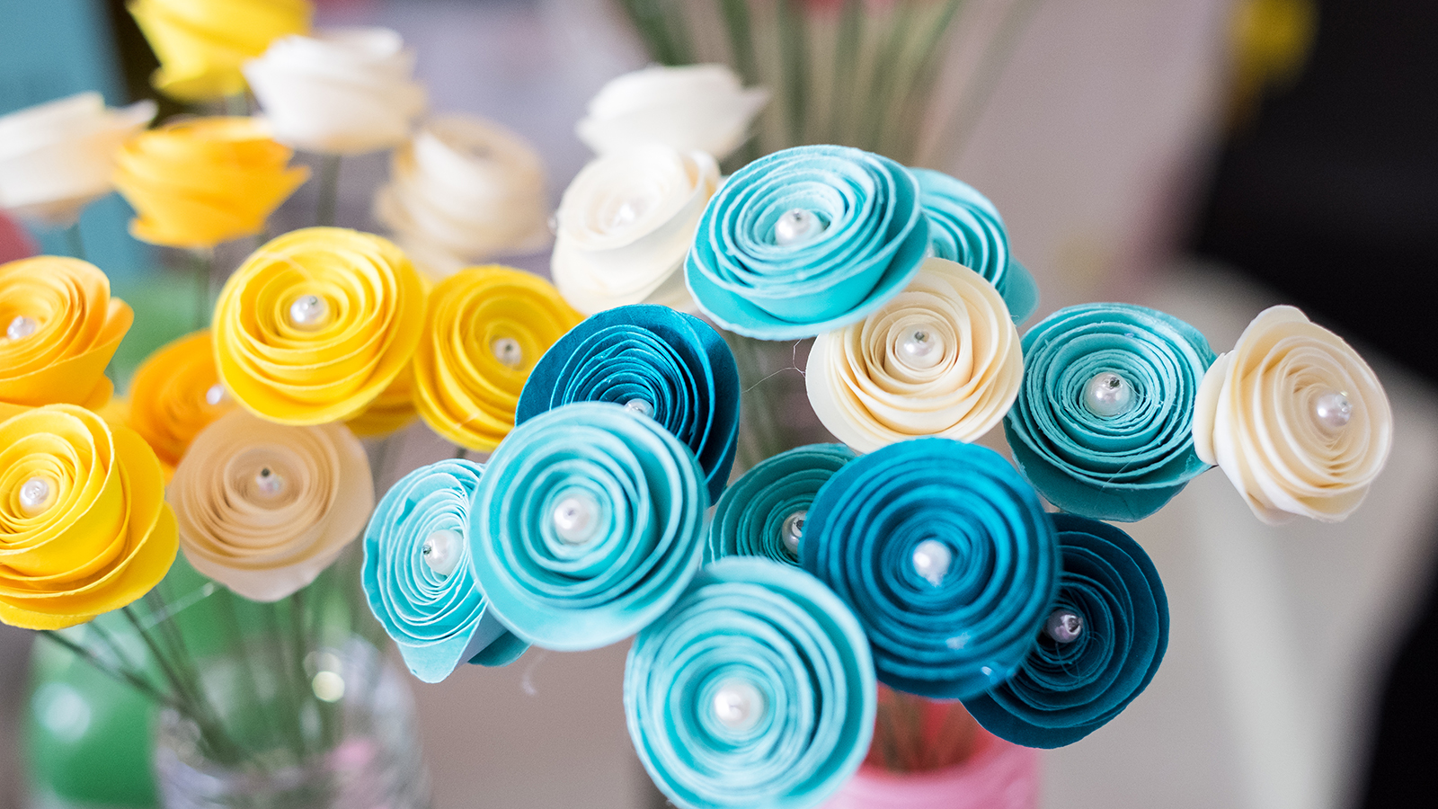 Colorful paper flowers handmade in a vase.
