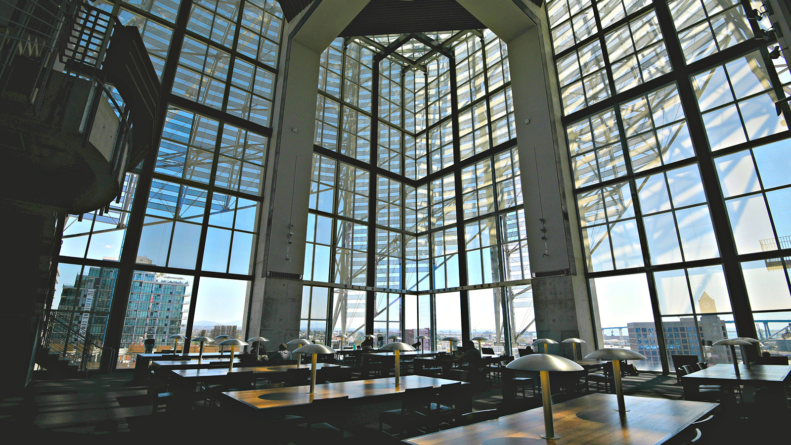 San Diego, California. March 1, 2018. Interior view of the Price Reading Room  on the eighth floor of the Central Library, surrounded by glass.