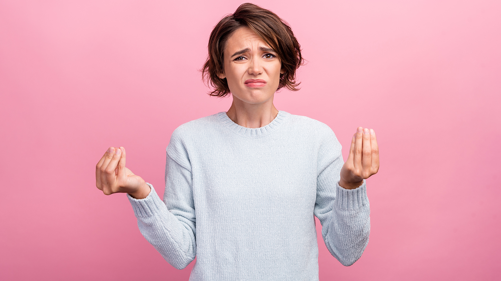 Photo of unhappy upset sad woman hold hand gesture money demand bad mood isolated on pink color background