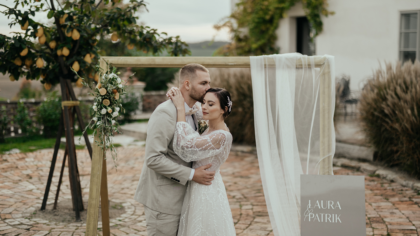 Tuscan luxury wedding of beautiful bride in white dress and groom in beige suit with rustic and boho decorations full of love