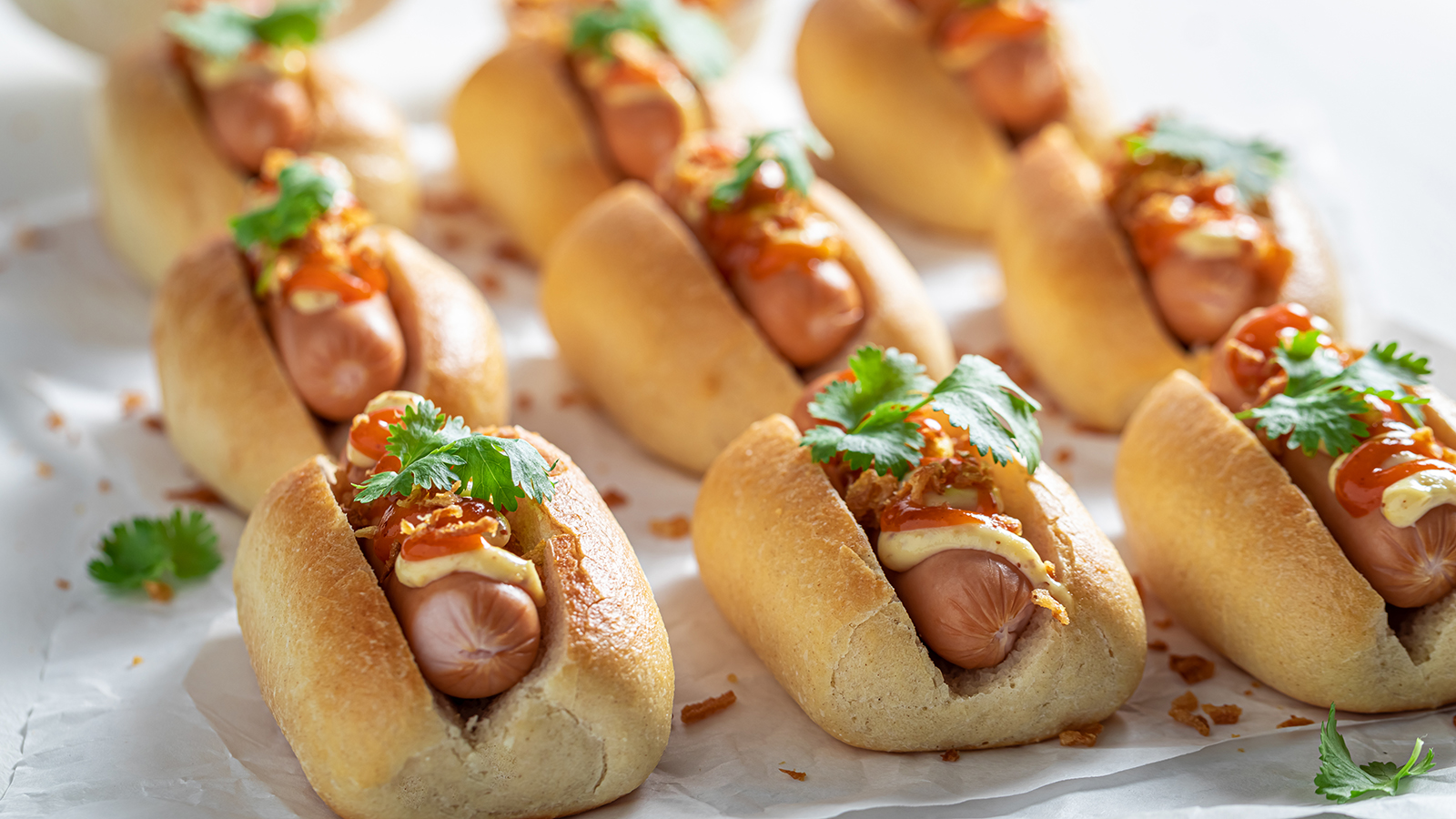 Spicy mini hot dogs with pork sausage and sauce