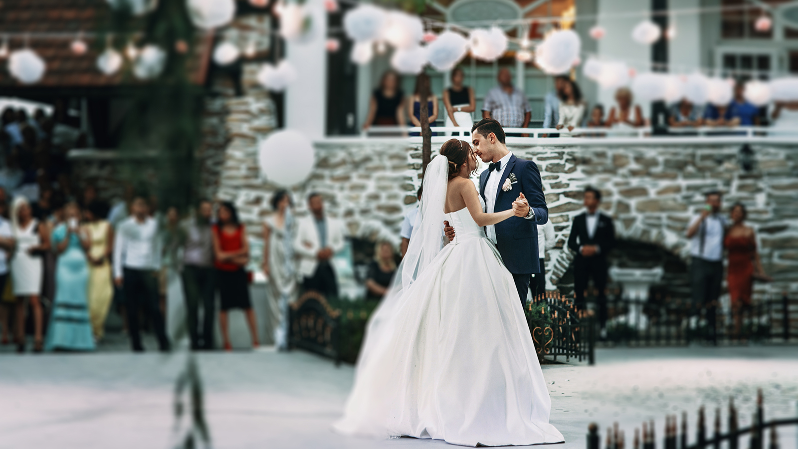 Sensual happy newlywed couple dancing outdoors at reception